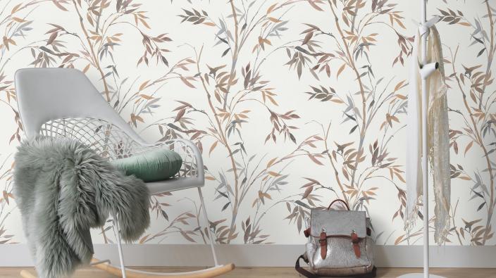 chair in front of bright wallpaper with bamboo leaves