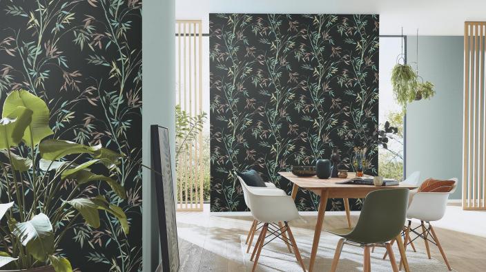 dining room with table and chairs and wallpaper with black backgound and green/brown/turqoise bamboo leaves