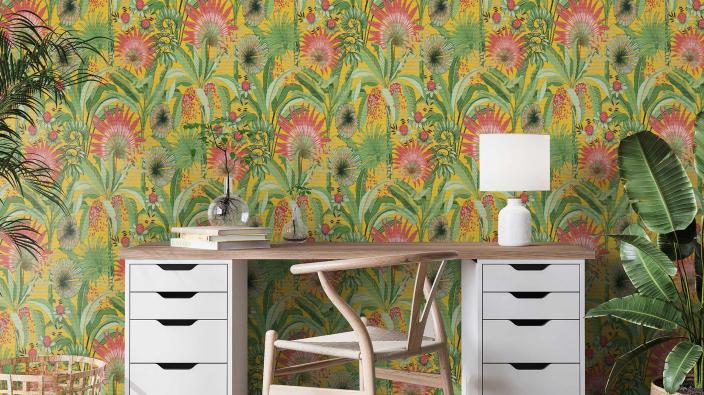 room with working desk and colourful wallpaper with garden motive